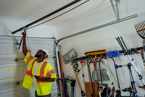 Professional Garage Door Installation technician working in Harrisburg, IL